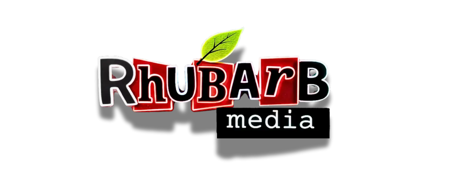 Rhubarb Media logo with a vibrant neon glow effect on a dark urban background, representing the high-contrast creative rebellion of the brand.